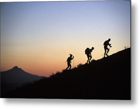 Adventure Racing Metal Print featuring the photograph Two Men And One Woman Run Up A Mountain by Corey Rich