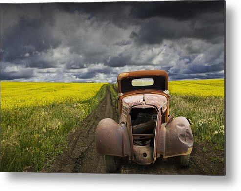 Vintage Metal Print featuring the photograph Vintage Chevy Pickup on a dirt path through a canola field by Randall Nyhof