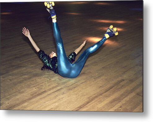 Youth Culture Metal Print featuring the photograph Woman having fun at roller disco by Flashpop