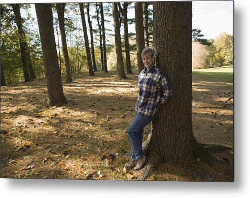 Tranquility Metal Print featuring the photograph Woman leaning against tree by Comstock Images