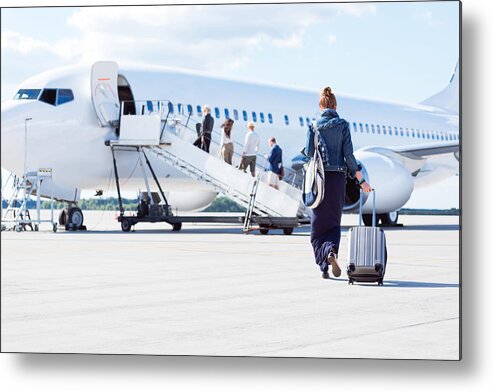 People Metal Print featuring the photograph Woman walking towards the airplane by Izusek