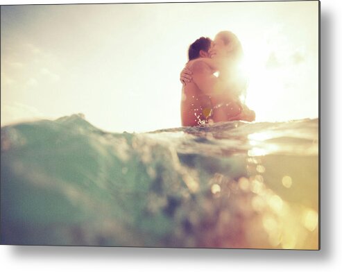 Young Men Metal Print featuring the photograph Young Couple Having Fun In The Sea by Nullplus