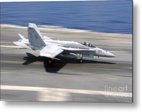 Flight Deck Metal Print featuring the photograph An Fa-18e Super Hornet Lands Aboard Uss by Stocktrek Images