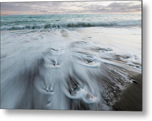 Coastline Metal Print featuring the photograph Pebbles in the beach and flowing sea water by Michalakis Ppalis
