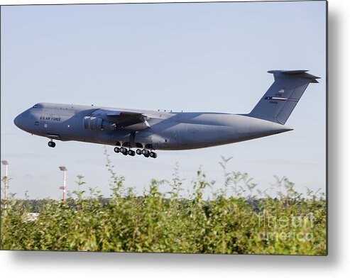 Ramstein Air Base Metal Print featuring the photograph A C-5a Galaxy Of The U.s. Air Force by Timm Ziegenthaler