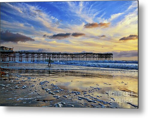 Pacific Beach Metal Print featuring the photograph A surfer heads home under a cloudy sunset at Crystal Pier by Sam Antonio