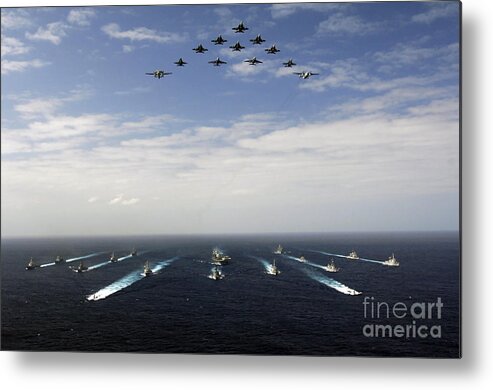 Horizontal Metal Print featuring the photograph Aircraft Fly Over A Group Of U.s by Stocktrek Images