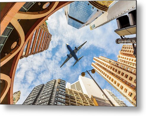 Hong Kong Metal Print featuring the photograph Airplane above city by Benny Marty