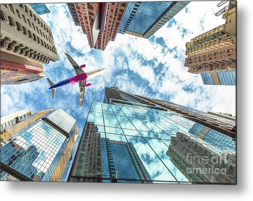 Hong Kong Metal Print featuring the photograph Airplane flying over skyscrapers by Benny Marty