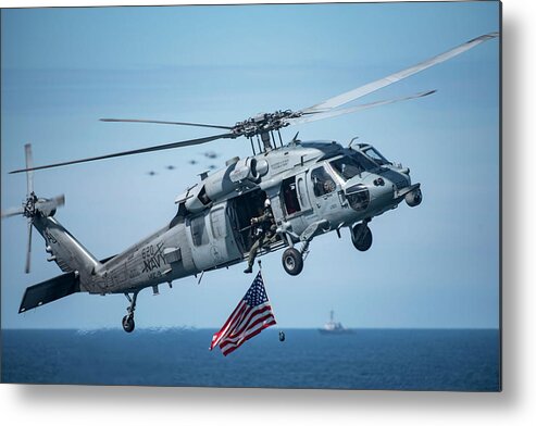 Military Metal Print featuring the painting An MH-60S Sea Hawk helicopter displays the American flag. by Celestial Images