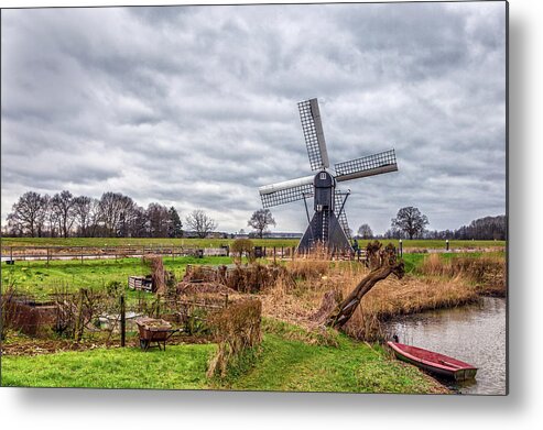 Windmill Metal Print featuring the photograph Beautiful landscape with a spiderhead mill in the Netherlands by Tim Abeln