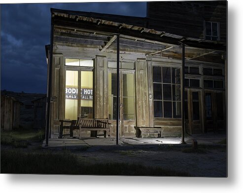Abandoned Metal Print featuring the photograph Bodie Hotel illuminated at night by Karen Foley
