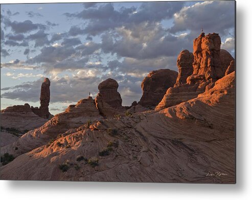 Arches National Park Metal Print featuring the photograph Climbers at sunset in Garden of Eden by Dan Norris