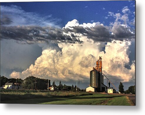 Sunsets Roads Sky Clouds Weather Blue Red Skies Hay Fields Elevators Terminals Silhouettes Evening Grain Bins Hay Straw Cumulus Trees Metal Print featuring the photograph Cloud Terminal by David Matthews