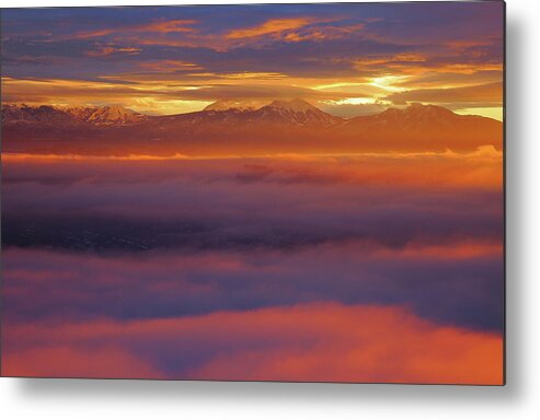 Sunrise Metal Print featuring the photograph Clouds of fire surround the La Sal Mountains from Dead Horse Point State Park by Jetson Nguyen