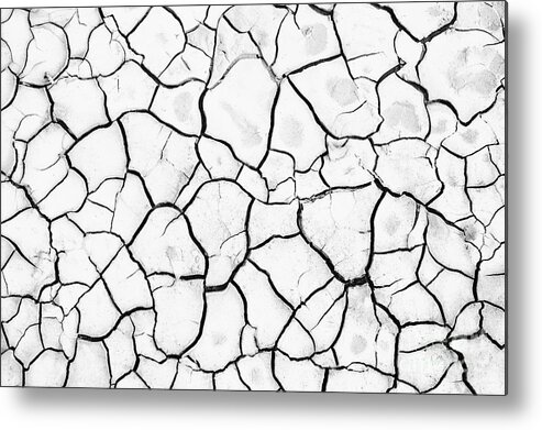 Abstract Metal Print featuring the photograph Cracked Mud by Brandon Tabiolo - Printscapes