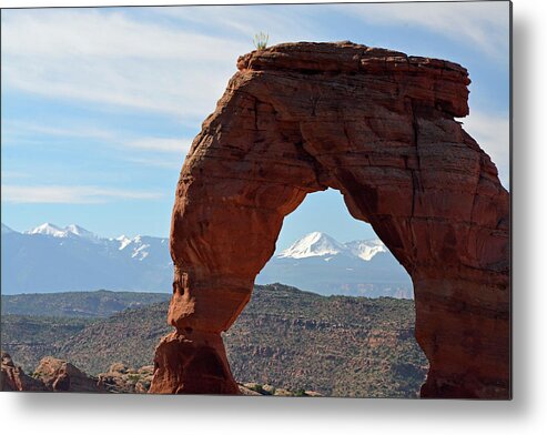 Arches Metal Print featuring the photograph Delicate Arch with Wispy Clouds by Bruce Gourley