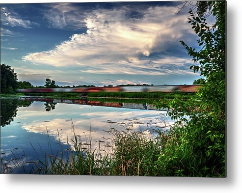Train Blurred Lake Clouds Reflection Blue Green Horizontal Evansville Wi Wisconsin Lake Leota Leota Park Metal Print featuring the photograph Frozen Reflections by Peter Herman