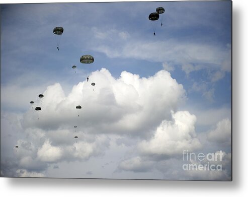 Soldier Metal Print featuring the photograph Halo Jumpers Descend To The Ground by Stocktrek Images