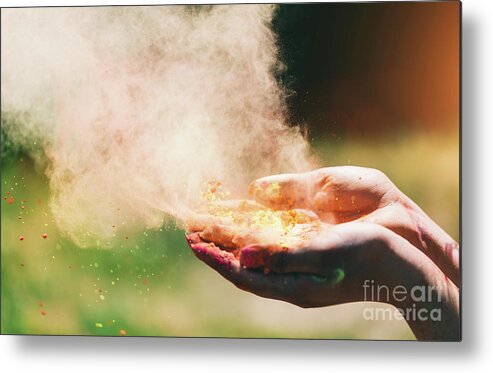 Hands Metal Print featuring the photograph Holi powder held in woman's hand and a cloud of dust by Michal Bednarek