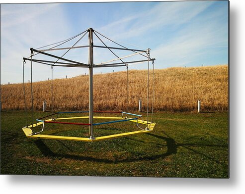 Playground Metal Print featuring the photograph Merry go round on the prairie by Jeff Swan