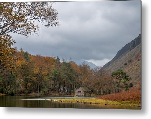 Autumn Metal Print featuring the photograph Moody clouds over a boathouse on Wast Water in the Lake District by Neil Alexander Photography