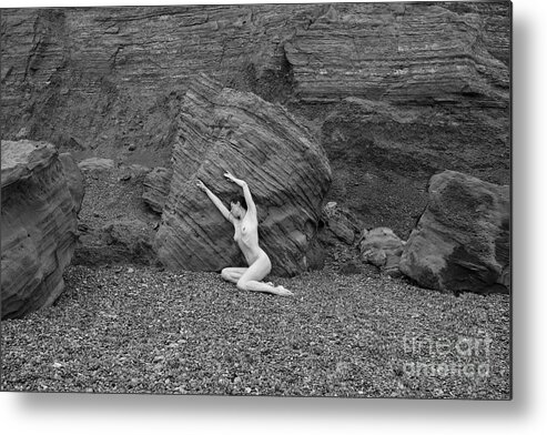 Woman Metal Print featuring the photograph Nude woman pulling shape by rocks by Clayton Bastiani