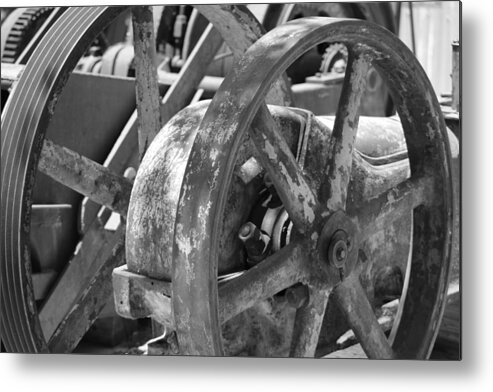 Black And White Metal Print featuring the photograph Old Industrial Wheel in Black and White by Colleen Cornelius