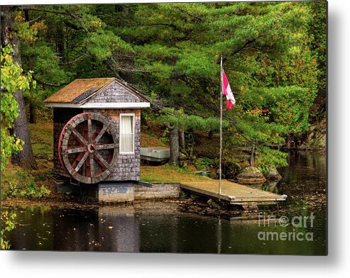 Colors Metal Print featuring the photograph Small shed with a large wooden wheel by Les Palenik