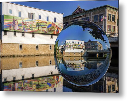Stoughton Wi Wisconson Mural Yahara River Glass Sphere Water Horizontal Buildings Metal Print featuring the photograph Stoughton Downtown Mural on Yahara River by Peter Herman