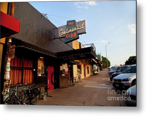 The Continental Club Metal Print featuring the photograph The Continental Club is a local favorite front door and sidewalk lo by Dan Herron