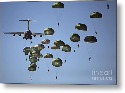 Parachutist Metal Print featuring the photograph U.s. Army Paratroopers Jumping by Stocktrek Images