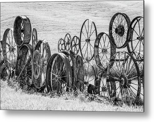 Agriculture Metal Print featuring the photograph Wagon wheel sculpture. by Usha Peddamatham