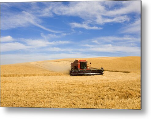 Combine Metal Print featuring the photograph Wheat Harvest by Michael Dawson