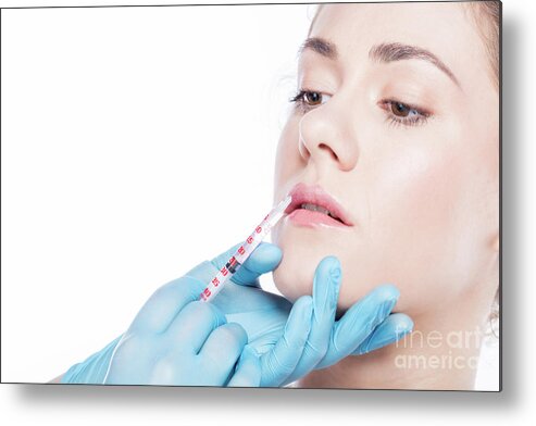 Aesthetic Metal Print featuring the photograph Young woman having lip-plumping injections. by Michal Bednarek