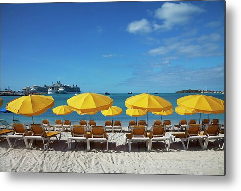 In A Row Metal Print featuring the photograph Beach Sun Loungers And Sunshades #1 by Onfilm