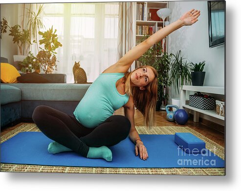 Pregnancy Metal Print featuring the photograph Pregnant Woman Doing Yoga At Home #4 by Microgen Images/science Photo Library