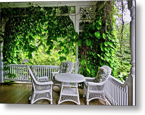 Beautiful Color Photograph Of Porch With Wicker Table And Chairs Metal Print featuring the photograph A Beautiful Porch View by Joan Reese