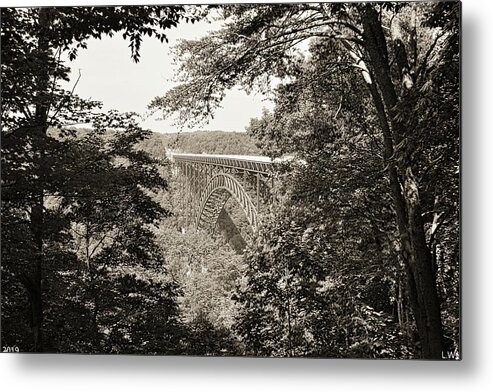 A Nature Framed View Of New River Gorge Bridge West Virginia Black And White Metal Print featuring the photograph A Nature Framed View Of New River Gorge Bridge West Virginia Black And White by Lisa Wooten
