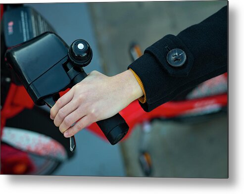 Handlebars Metal Print featuring the photograph Aerial Shot Of A Hand Taking The Handlebars Of A Bicycle. by Cavan Images