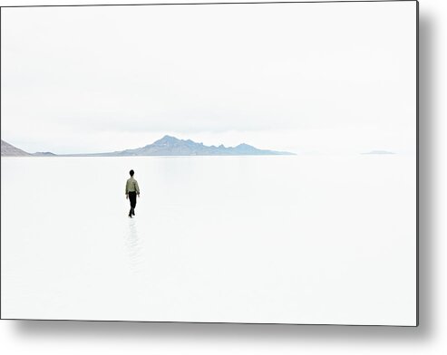 Scenics Metal Print featuring the photograph Businessman In Shallow Water In by Thomas Barwick