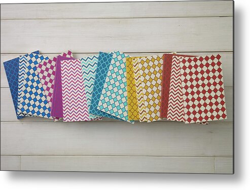 Hanging Metal Print featuring the photograph Colorful Pattern Of Notebooks by Mark Lund