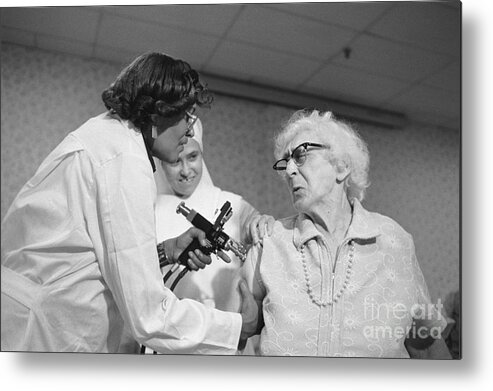 Centers For Disease Control And Prevention Metal Print featuring the photograph Elderly Woman Wincing by Bettmann