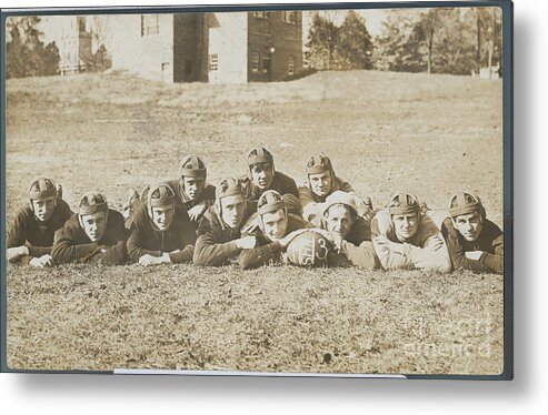 People Metal Print featuring the photograph Football Team Posing On Grass by Bettmann