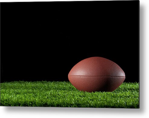 Shadow Metal Print featuring the photograph Gridiron Ball On The Grass At Night by Courtneyk