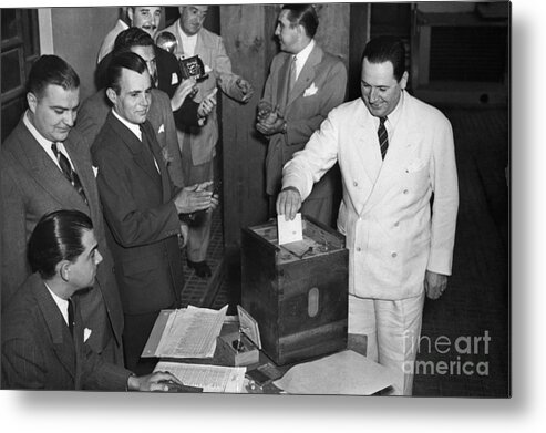 Constitution Metal Print featuring the photograph Juan Peron Voting In Argentina by Bettmann