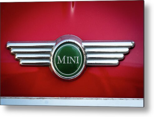 Mini Metal Print featuring the photograph Mini Cooper car logo on red surface by Michalakis Ppalis