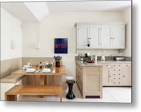 Ip_11173696 Metal Print featuring the photograph Modern Dining Area With Mixture Of Various Benches And Stools Next To L-shaped, Shaker-style Fitted Kitchen; Sign With Bold Lettering by Simon Maxwell Photography