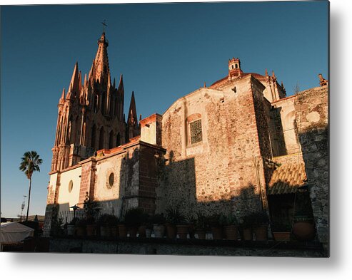 Mexico Metal Print featuring the photograph Parroquia De San Miguel Arcangel From Behind As The Sun Sets On Walls by Cavan Images