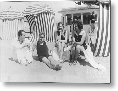 People Metal Print featuring the photograph People Relaxing On The Beach by Bettmann